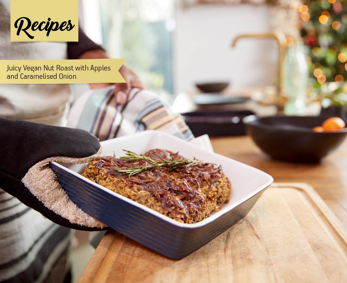 photo with Close Up Of Man Taking Vegetarian Nut Roast Out Of Oven For Christmas Dinner