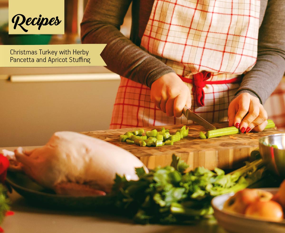 Young Woman Cooking in the kitchen with Healthy ingredients and turkey