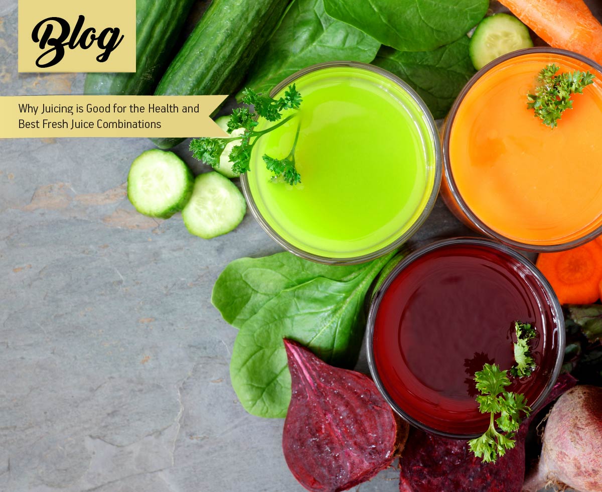 Three glasses of healthy vegetable juice with scattered ingredients, above view over a slate background