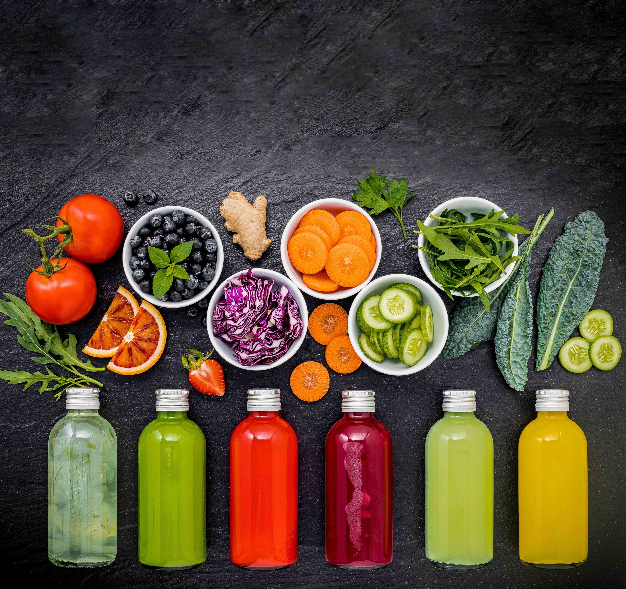 photo with Colourful healthy smoothies and juices in bottles with fresh tro