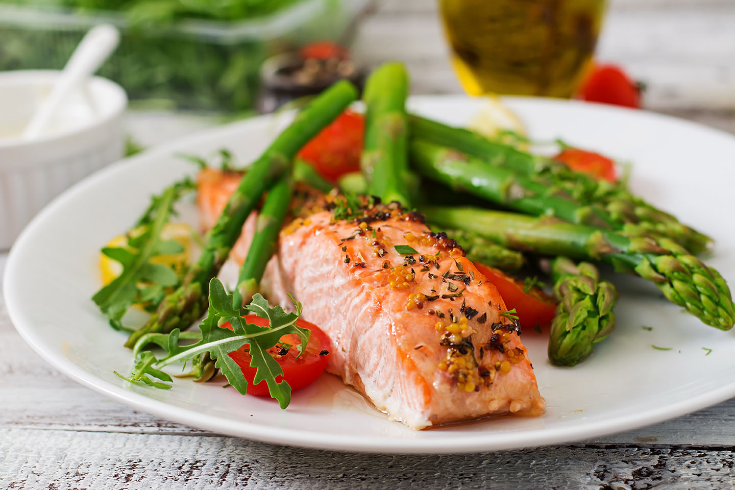 photo with Baked salmon garnished with asparagus.