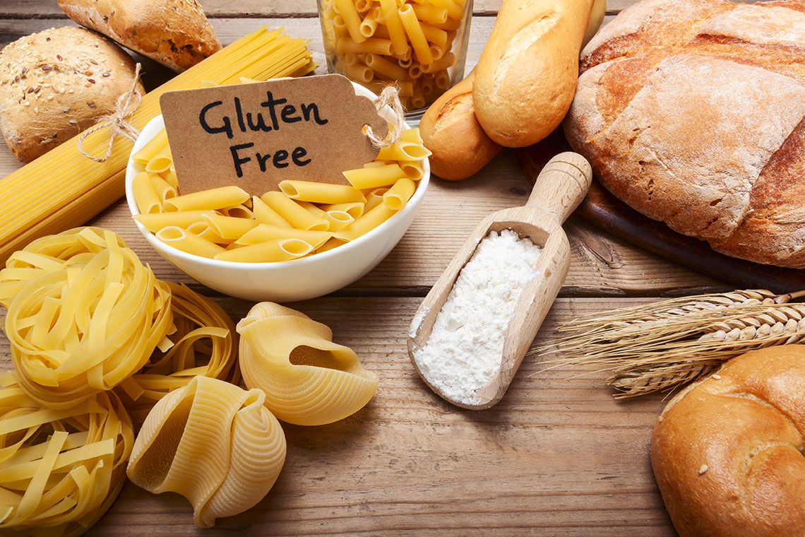 a gluten free breads and pasta on wood background